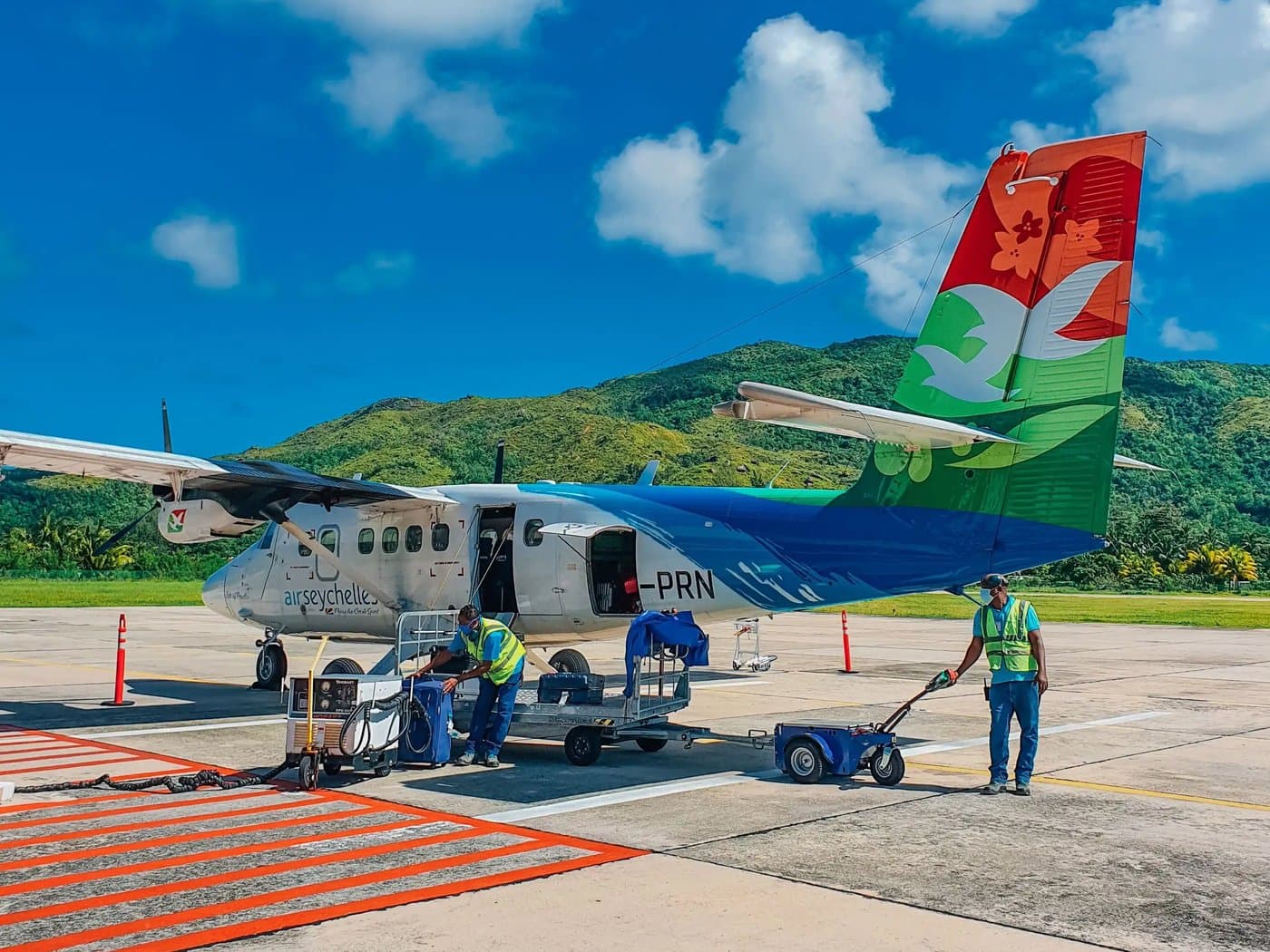 Luggage being loaded onto an aircraft on the apron in Seychelles